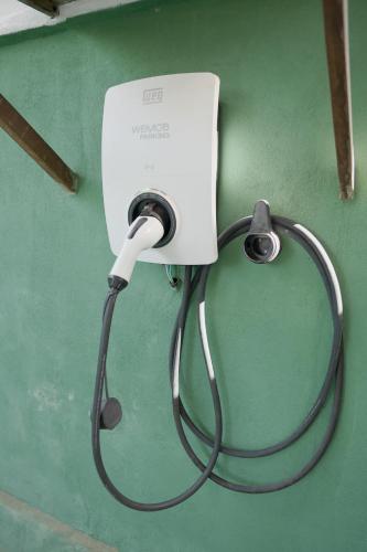a stethoscope hooked up to a white wall with at Xamã Senses - Hotel Pousada in Pipa