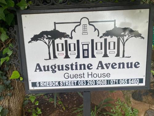 a sign for aquestineane guest house with trees on it at Augustine Avenue Guest House in Ladysmith