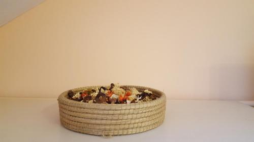 a basket filled with stuffed animals sitting on a table at Studio Piata Sfatului - Brasov in Braşov