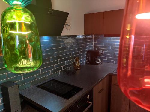 a kitchen with a green glass vase on the counter at Prospect in Motovun