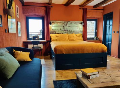 a bedroom with a large bed and a couch at Prospect in Motovun
