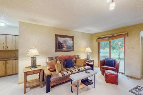 a living room with a couch and a chair at Ten Mile Haus in Frisco