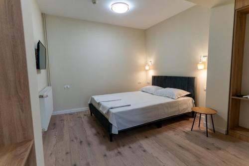 Ένα ή περισσότερα κρεβάτια σε δωμάτιο στο Vila Mihu Cetate