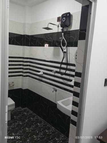 Koupelna v ubytování Akash Premium Hotel