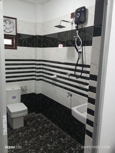 Koupelna v ubytování Akash Premium Hotel