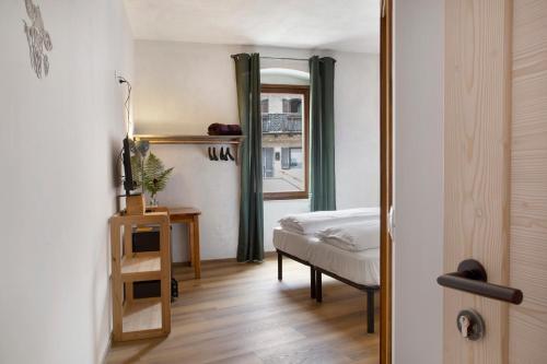 Ένα ή περισσότερα κρεβάτια σε δωμάτιο στο Edelweiss Alp Rooms