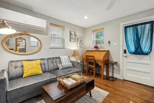 a living room with a couch and a table at The Cultural District Cottage in Fort Worth