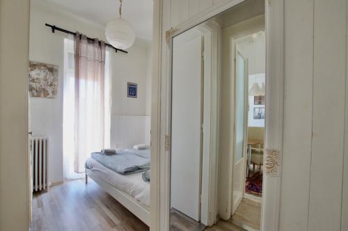 a bedroom with a bed and a mirror at Standard Apartment by Hi5 - Károly 23 in Budapest