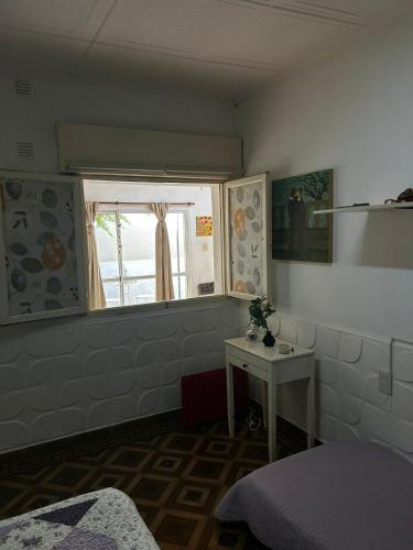 Una cama o camas en una habitación de Casa Refugio