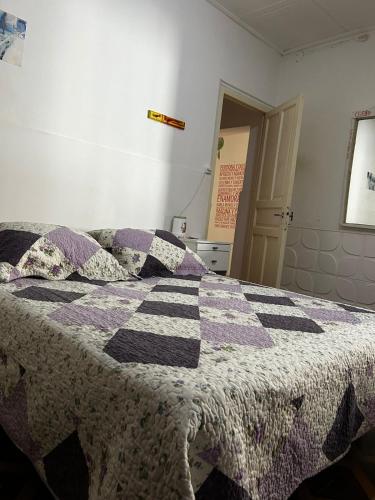 Una cama o camas en una habitación de Casa Refugio