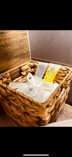 a basket filled with towels sitting on a counter at Utopia Inn უტოპია ინნ in Batumi