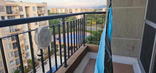 a balcony of a building with a fan at Hacienda Peñalisa Mango in Ricaurte