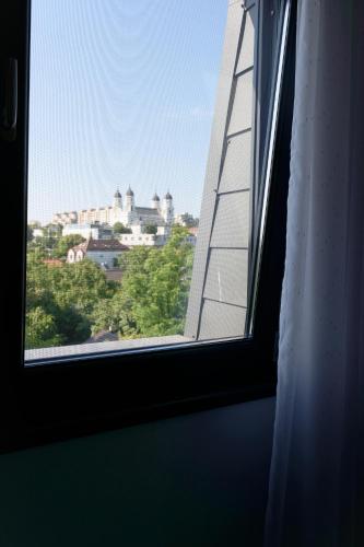 a window with a view of a city at Hotel Palas Grand View in Iaşi