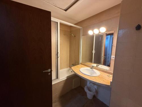 a bathroom with a sink and a mirror at La Cassia Holidays in Tetouan