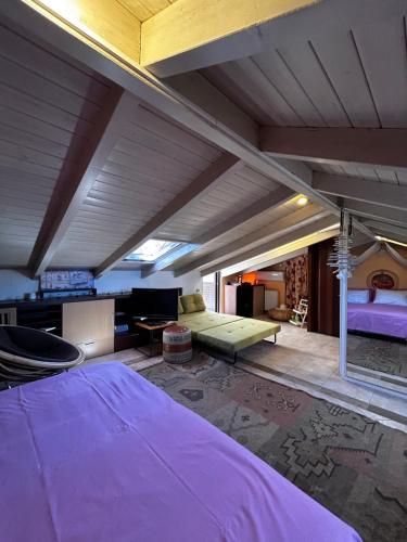 a large room with a bed and a couch at You & Me, near the sea and Patras University in Patra