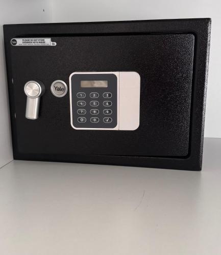 a microwave with a remote control on a table at Apartments Maritea in Vodice