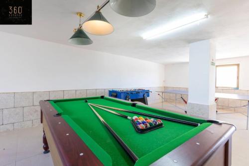a billiard table in a room with a pool table at Huge Villa with Pool, BBQ and Spectacular Views by 360 Estates in Il-Qortin taʼ Għajn Żejtuna