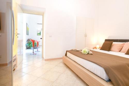 En eller flere senge i et værelse på Gargar home Sorrento
