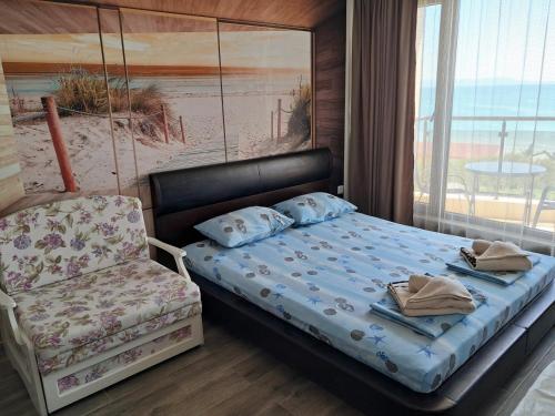 En eller flere senge i et værelse på Apart Hotel Iglika