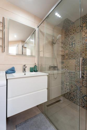 a bathroom with a sink and a shower at The Skippers Nest in San Miguel de Abona