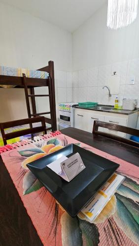 a tray sitting on top of a table in a kitchen at Morro Branco Pousada e aptos in Natal