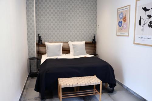 Postel nebo postele na pokoji v ubytování Hotel Petite B&B