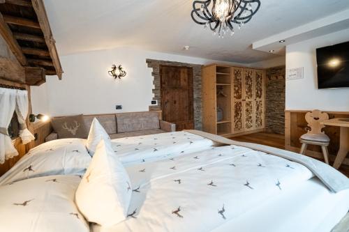 Postel nebo postele na pokoji v ubytování Hotel Jägerheim 3S
