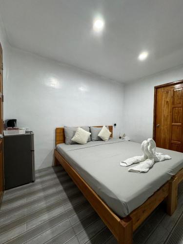a bedroom with a bed with a stuffed animal on it at KADIJ Guest House in San Juan