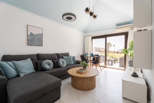 a living room with a couch and a table at The Skippers Nest in San Miguel de Abona