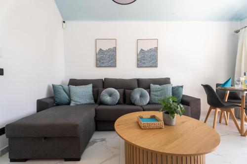 a living room with a couch and a table at The Skippers Nest in San Miguel de Abona