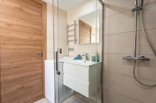 a bathroom with a sink and a shower at The Skippers Nest in San Miguel de Abona