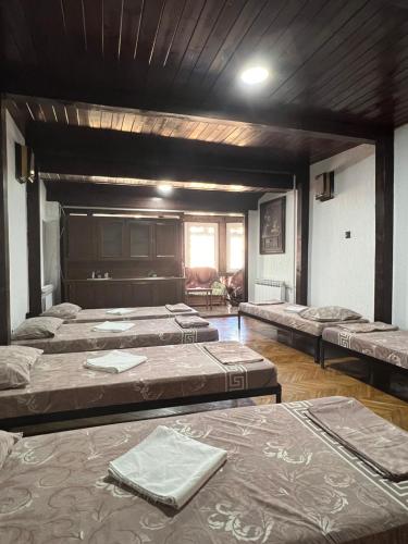 a room with four mattresses in a room with at Top House in Šabac