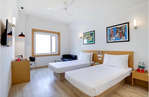 Postel nebo postele na pokoji v ubytování Hotel Zed -Near IGI-Airport-Terminal-3