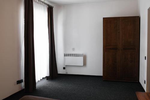 an empty room with a door and a window at ZimaSnow Ski & Spa Club in Bukovel