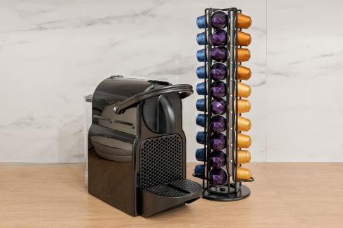 a toaster sitting on top of a wooden table at Holiday 33 Apartment O, 4 rooms and whirlpool in Berlin