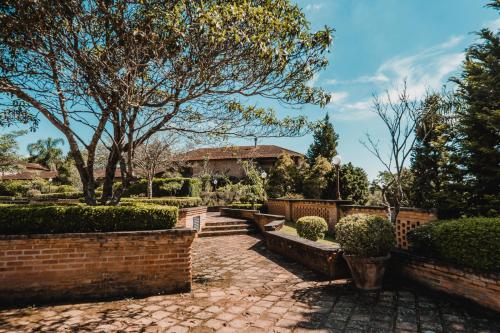 a brick path in front of a house at Haras Buona Fortuna in Cotia