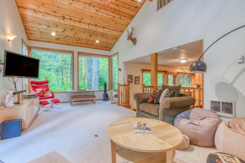 a living room with a couch and a table at The Burrow at Zig Zag in Rhododendron