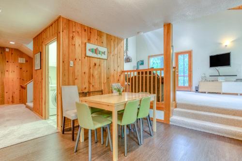 a dining room with a wooden table and chairs at The Burrow at Zig Zag in Rhododendron