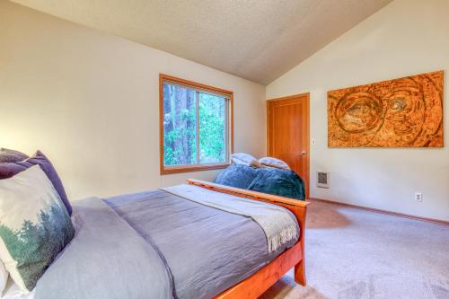 a bedroom with a bed and a window at The Burrow at Zig Zag in Rhododendron