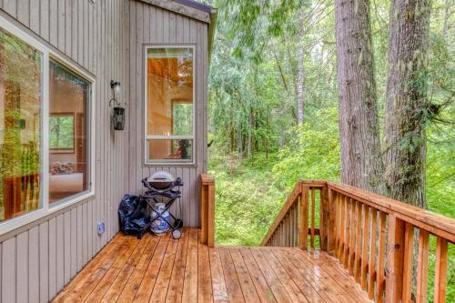 a stroller sitting on a wooden deck on a house at The Burrow at Zig Zag in Rhododendron