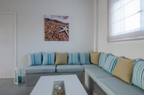 a living room with a couch and a table at Brother's Hotel in Ios Chora