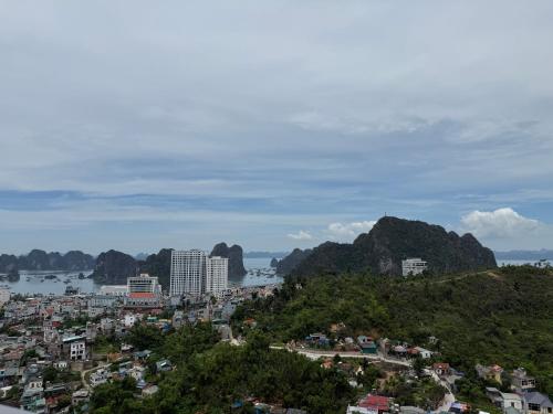 a view of a city with mountains and the ocean at Sun View Homestay in Ha Long
