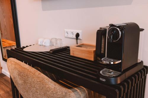 a microwave sitting on top of a table at Farmhotel Efstidalur in Laugarvatn