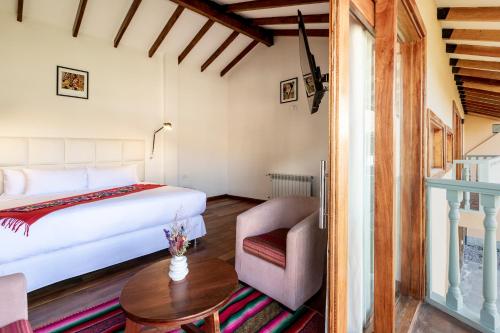 Ένα ή περισσότερα κρεβάτια σε δωμάτιο στο Casa Eva Hotel Boutique