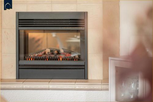 a fireplace with a fire inside of it at Förster-Schrödter-Str 10-14 Strandbrise in Ostseebad Koserow