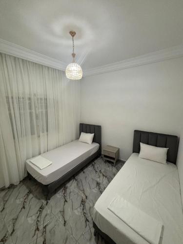 Ένα ή περισσότερα κρεβάτια σε δωμάτιο στο Appartement climatisé à TABARKA 1