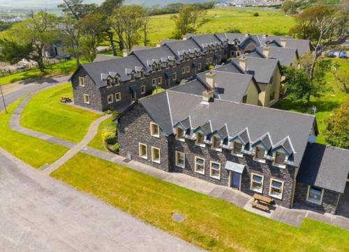 an aerial view of a large house at Dingle Courtyard Cottages 2 Bed Sleeps 4 in Dingle