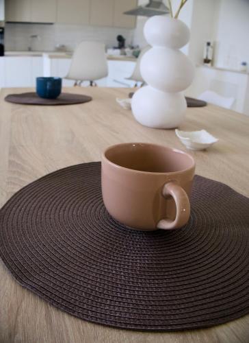 a coffee cup sitting on top of a table at Ca' del Mar in Minturno