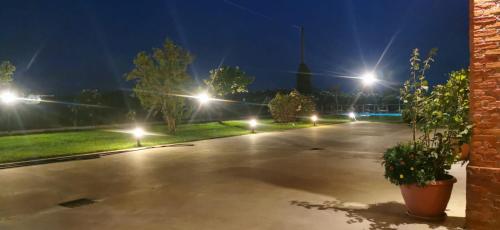 an empty parking lot at night with street lights at Cascina Olmetto di Sotto in Ghedi