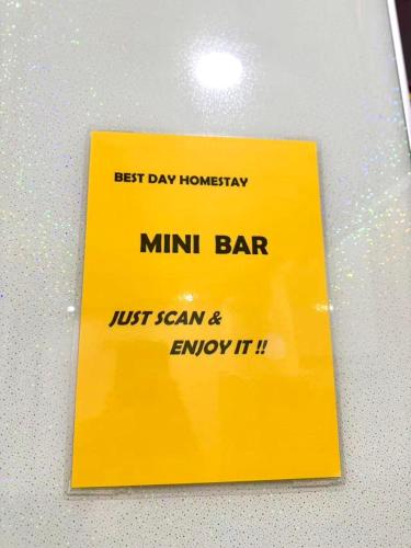 a yellow sign on top of a table at Best Day Homestay ! in Kangar